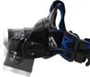 A close-up side view of a black LED headlamp with a blue and black patterned strap, set against a white background. Náhľad obrázku produktu