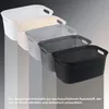 Four laundry baskets of different colors are lined up diagonally against a gradient background. Produktbild-Vorschau
