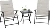 Two beige upholstered folding chairs and a small black folding table with a glass top, set against a white background. Produktbild-Vorschau