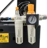 Close-up of an air compressor's filtration and pressure regulation system. Produktbild-Vorschau