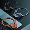 Three pairs of wireless headphones in different colors are displayed on a laptop keyboard and a dark surface. Produktbild-Vorschau