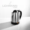 A silver electric kettle with a black handle and lid is placed on a white surface. The brand logo 'LEHMANN HOME' is visible in the background. Podgląd zdjęcia produktu