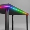 Close-up of a black gaming desk with RGB LED lighting along the edge. Produktbild-Vorschau
