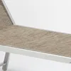 A close-up view of a section of a lounge chair, showing the fabric and frame. Produktbild-Vorschau
