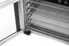 A close-up view of the interior of a food dehydrator, showing multiple wire racks and perforated trays. Podgląd zdjęcia produktu