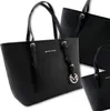 Three black tote bags are displayed against a white background. The main bag in the foreground has the brand name 'MICKY KEN' and a circular logo with an 'M' on it. Produktbild-Vorschau
