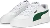 A pair of white Puma sneakers with green accents. Produktbild-Vorschau