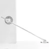 A close-up shot of a white cabinet hinge mechanism with a silver arm extended. Produktbild-Vorschau