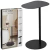A black metal side table is shown next to its packaging, which displays product information and different color options. Voir les images du produit