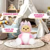 A teddy bear dressed as a unicorn sits on a rug in a child's room with a teepee in the background. Produktbild-Vorschau