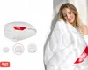 A collage showing a folded duvet and a woman hugging a duvet. Produktbild-Vorschau