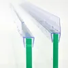 Two clear plastic shower door seals are shown attached to green glass panels. Podgląd zdjęcia produktu