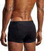 The back view of a person wearing black boxer shorts. Produktbild-Vorschau