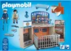 The image shows the packaging of a Playmobil police station playset, displaying the product and its accessories. Podgląd zdjęcia produktu