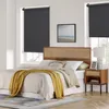 A bedroom scene with a bed, headboard, nightstand, and window with blinds. Produktbild-Vorschau