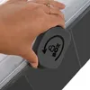 A hand is shown turning a gray locking mechanism on a storage box. Náhled obrázku produktu
