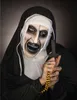 A person dressed as a scary nun from a horror film, holding a rosary and a cross. Produktbild-Vorschau