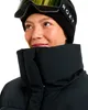 A close-up shot of a woman wearing a black beanie and ski goggles, with a black puffer jacket. Náhľad obrázku produktu