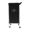 A black salon trolley with silver accents and wheels, shown against a white background. Voir les images du produit