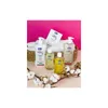 A collection of baby care products arranged in a basket with cotton branches in the foreground. Produktbild-Vorschau
