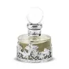 A perfume bottle with intricate silver detailing. Voir les images du produit