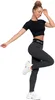 A woman is posing in athletic wear. Produktbild-Vorschau