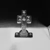 A close-up of a metal hinge attached to a white surface and a dark textured surface. Anteprima dell’immagine prodotto