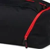 Close-up of a black duffel bag with a red zipper. Produktbild-Vorschau