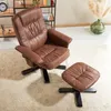 A brown leather-look armchair and ottoman are shown on a cream rug in a room. Produktbild-Vorschau