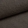 A close-up view of a brown bouclé fabric. Produktbild-Vorschau