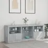 A modern grey sideboard with glass shelves and doors, displayed in a room with framed art on the wall and a patterned rug on the floor. Produktbild-Vorschau
