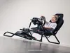 A young boy is happily playing a racing simulator game. Produktbild-Vorschau