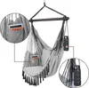 A grey hanging chair with black tassels and ropes, suspended from a metal bar. It features pockets and a holder for a bottle. Close-up insets highlight the pockets and bottle holder. Produktbild-Vorschau