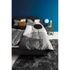 A bedroom scene with a bed, nightstand, and rug. Produktbild-Vorschau