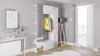 A modern hallway with a white wardrobe unit featuring a mirror, a console table with decorative items and a radiator, and a doorway leading outside. Produktbild-Vorschau