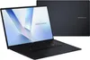 A black ASUS Vivobook laptop is shown from a diagonal front-facing angle, with its screen displaying a light blue and white abstract wallpaper. A second, identical laptop is visible in the background, showing its closed lid with the ASUS Vivobook logo. Produktbild-Vorschau