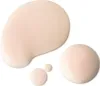 Several drops of a light-colored liquid, likely a cosmetic product, are shown on a white background. Produktbild-Vorschau