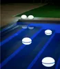 Floating lights in a swimming pool at night. Produktbild-Vorschau