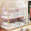 A children's bunk bed with a house-like design, complete with stairs and safety rails, set in a room with a pink and yellow patterned wall. Anteprima dell’immagine prodotto