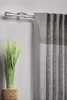 A curtain rod with a gray curtain and a potted plant. Produktbild-Vorschau