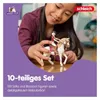 A young girl is playing with a toy horse and rider set. Náhľad obrázku produktu
