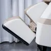 Close-up view of the padded armrest and leg rest of a massage chair. Produktbild-Vorschau