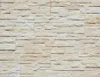 A full-frame shot of a wall covered in stacked stone veneer tiles. Podgląd zdjęcia produktu