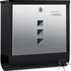 A black and silver mailbox with a brushed metal front, a lock, a mail slot, and three square decorative elements. Two keys are visible in the bottom right corner. Produktbild-Vorschau
