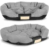 Two views of a gray and black dog bed with a beige tag. Anteprima dell’immagine prodotto
