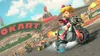 A group of characters from Mario Kart racing on a track. Produktbild-Vorschau