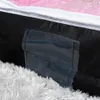 A close-up view of a storage bag for bedding, showing its texture and a small pocket. Produktbild-Vorschau