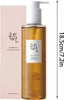 A bottle of Beauty of Joseon Ginseng Cleansing Oil and its packaging are shown against a white background, with a ruler indicating the product's height. Anteprima dell’immagine prodotto