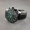 A close-up shot of a Festina chronograph watch with a green dial and black leather strap, placed on a textured gray surface. Náhled obrázku produktu