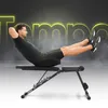 A man is performing an abdominal exercise on a black adjustable workout bench against a dark, smoky background with glowing yellow text. Náhľad obrázku produktu